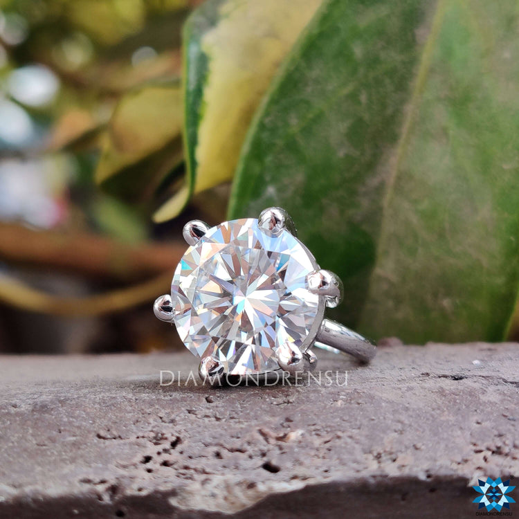Round cut moissanite engagement ring for everlasting charm.