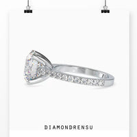 Pave engagement ring with a round cut diamond in a rose gold, white gold, or yellow gold ring.