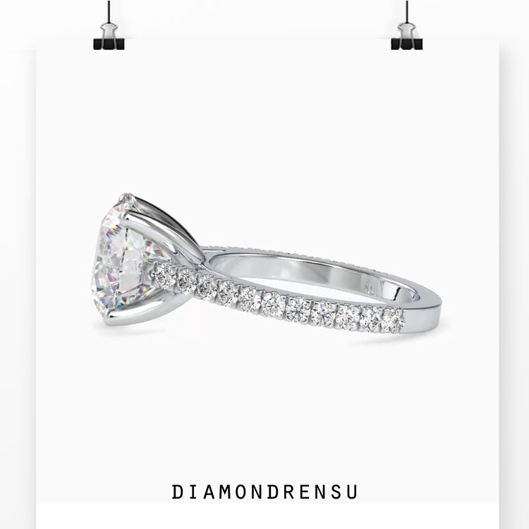 Pave engagement ring with a round cut diamond in a rose gold, white gold, or yellow gold ring.