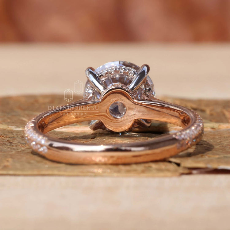 Two tone white and rose gold 3 sided pave diamond ring.