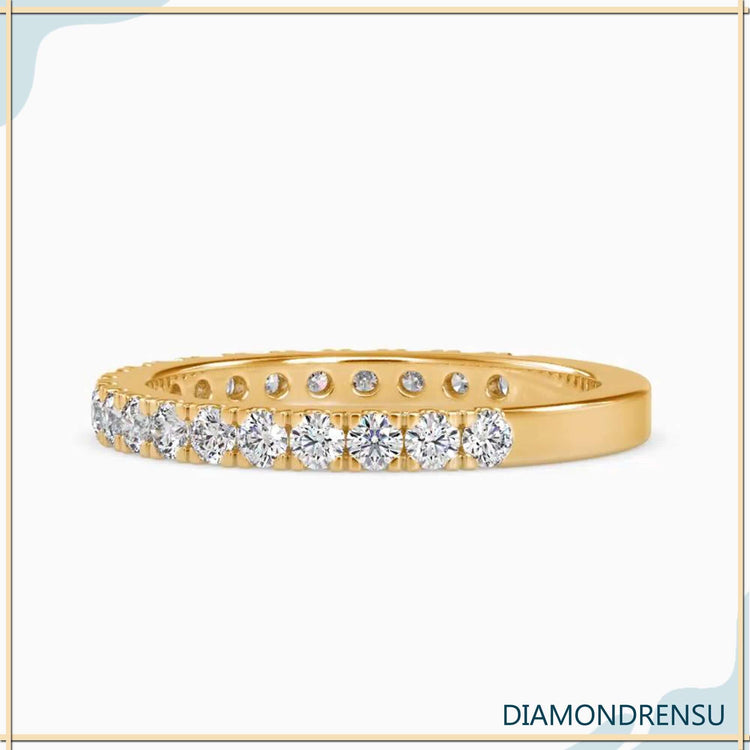 Pave diamond semi eternity wedding band with round brilliant cut diamonds.