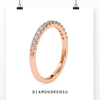 Half eternity diamond band in white gold, crafted for a modern wedding.