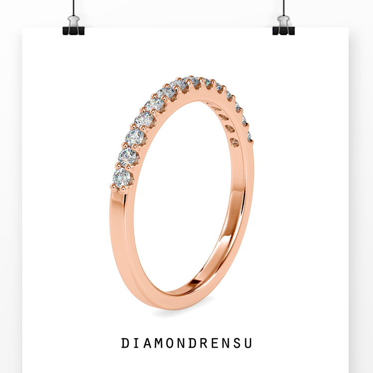 Half eternity diamond band in white gold, crafted for a modern wedding.