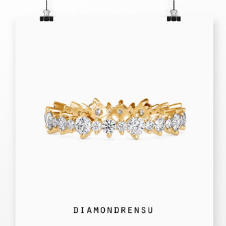 Handmade floating bubble band featuring round cut diamonds for a modern wedding band style.