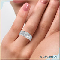 Designer wedding band with a bezel set round diamond for a modern look.