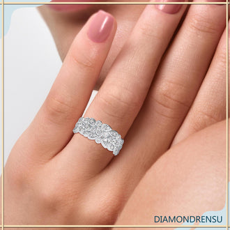 Designer wedding band with a bezel set round diamond for a modern look.