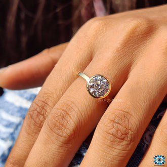 Beautifully crafted round bezel engagement ring for a timeless look.
