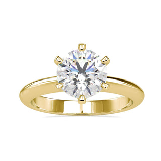 Round solitaire engagement ring featuring a timeless and elegant design.