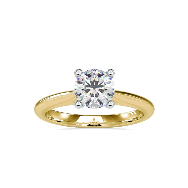Diamond solitaire ring with a round brilliant cut stone, set in a handmade knife edge band for a sleek, modern look.