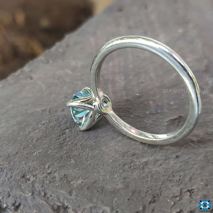 A sparkling moissanite engagement ring set in white gold, designed for those who love classic beauty with a twist.