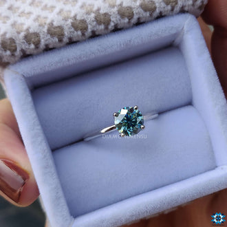 Exquisite moissanite solitaire engagement ring with a dazzling round cut, ideal for modern brides.