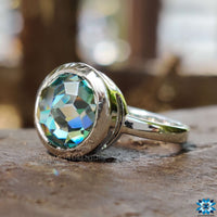 A sophisticated engagement ring with bezel setting, complemented by a two-tone solitaire design.