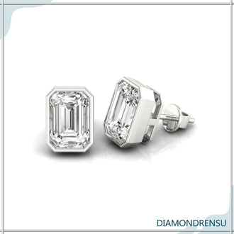 Exquisite bezel diamond studs in a gold bezel setting, ideal for formal wear.