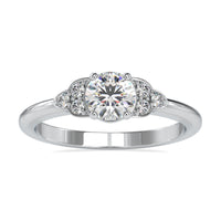 Round diamond engagement ring with a shared prong setting in white gold