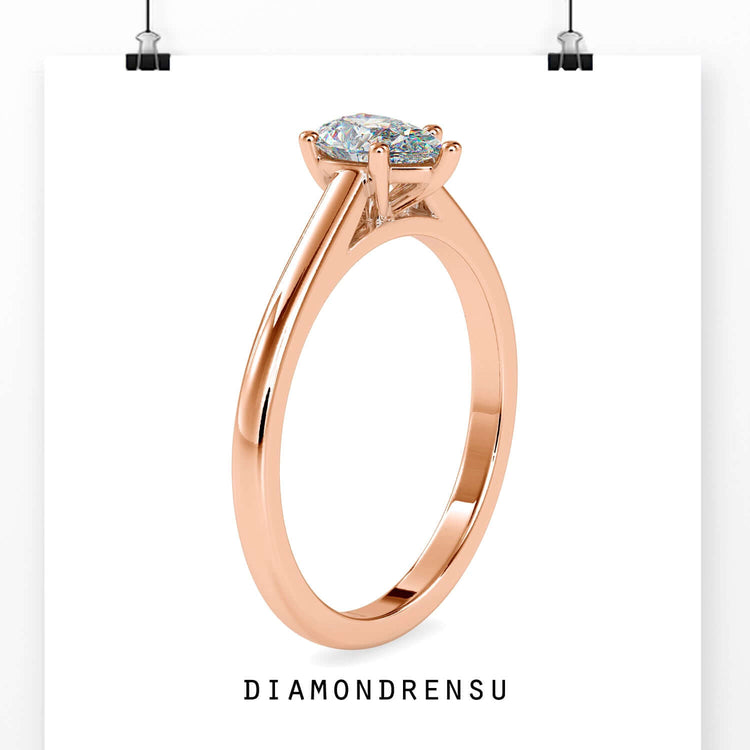 Pear cut diamond ring with a solitaire design, crafted by DiamondRensu for timeless beauty.