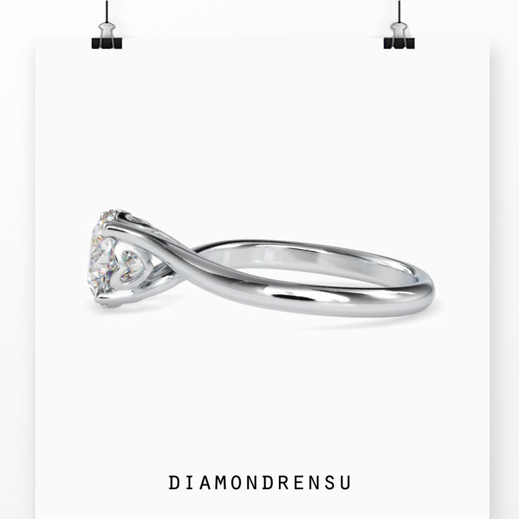 Solitaire engagement ring with a radiant round brilliant diamond.