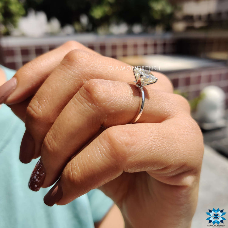 Radiant cut engagement ring with tab prongs for added security.