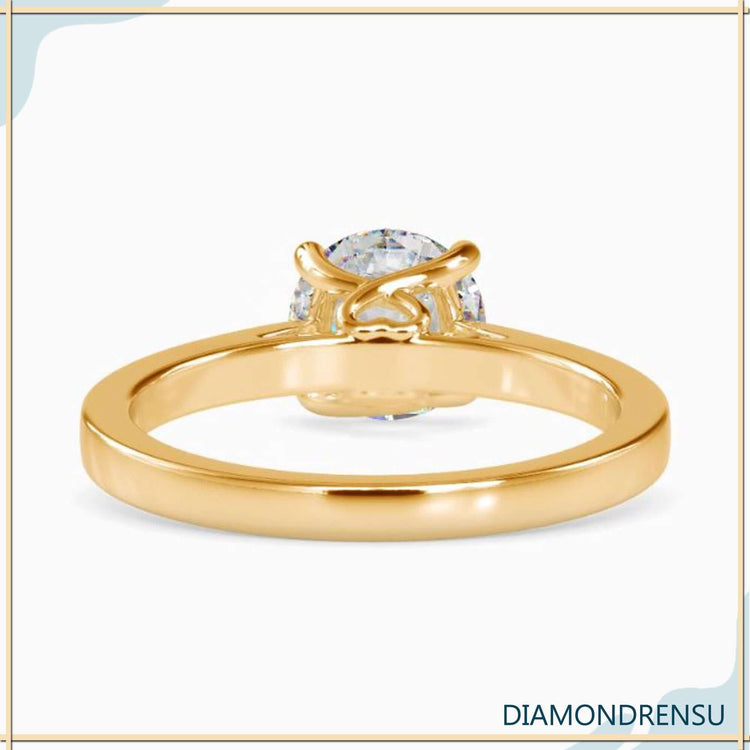 Round solitaire engagement ring in a classic 4 prong setting.