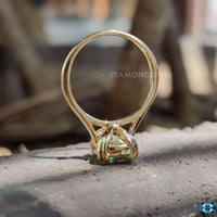 A radiant elongated cushion moissanite ring featuring a claw prong setting.