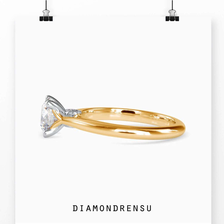 Round brilliant cut diamond ring with a knife edge band, blending minimalist design with DiamondRensu’s craftsmanship.