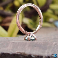 Stunning round solitaire moissanite engagement ring in 4 prong setting.