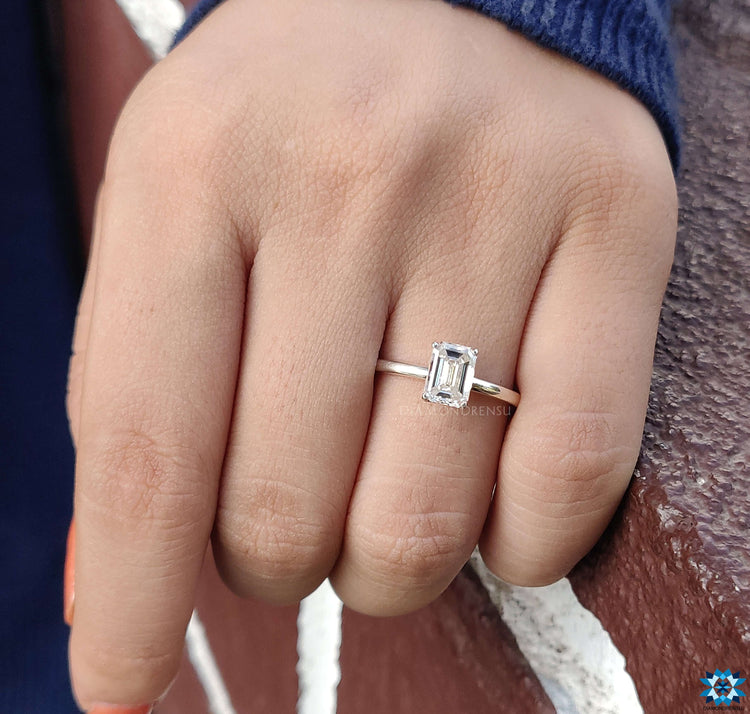 Unique moissanite emerald cut engagement ring with brilliance.