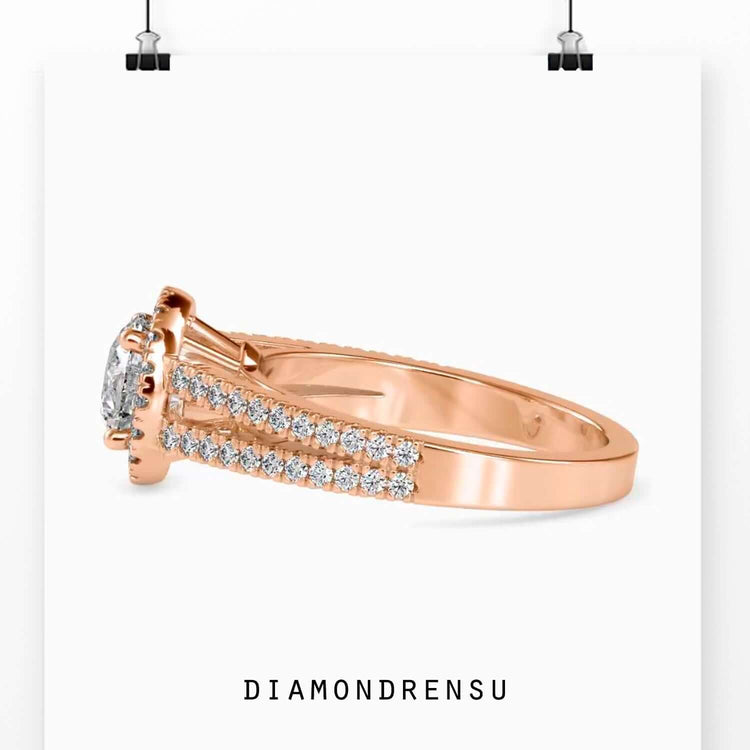 Pave engagement ring with a round halo diamond and a split shank design for modern elegance.