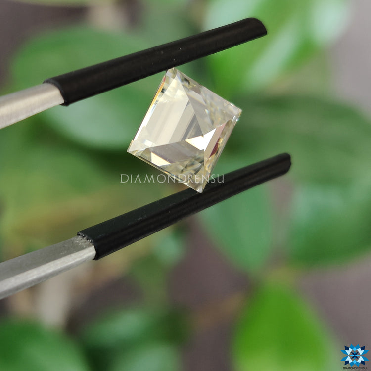 2.2 carat moissanite shining beside antique cut moissanite.