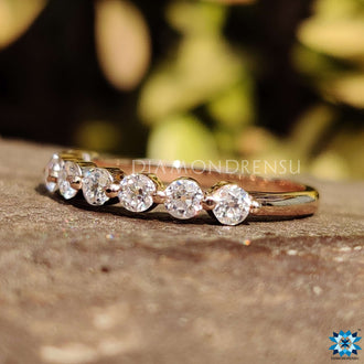 Moissanite stone set in a stunning gold ring design.