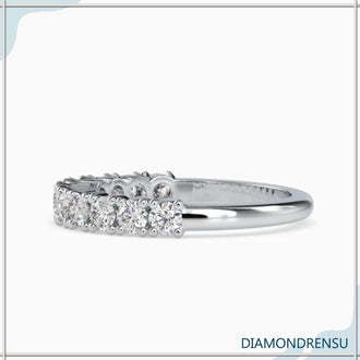 Half diamond band with shared prong setting for maximum brilliance.
