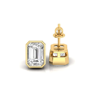 Emerald cut stud earrings in gold, offering a modern yet classic style.