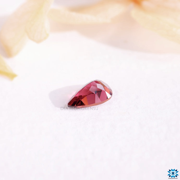 Pink gemstone 0.9 carat pear cut gemstone.