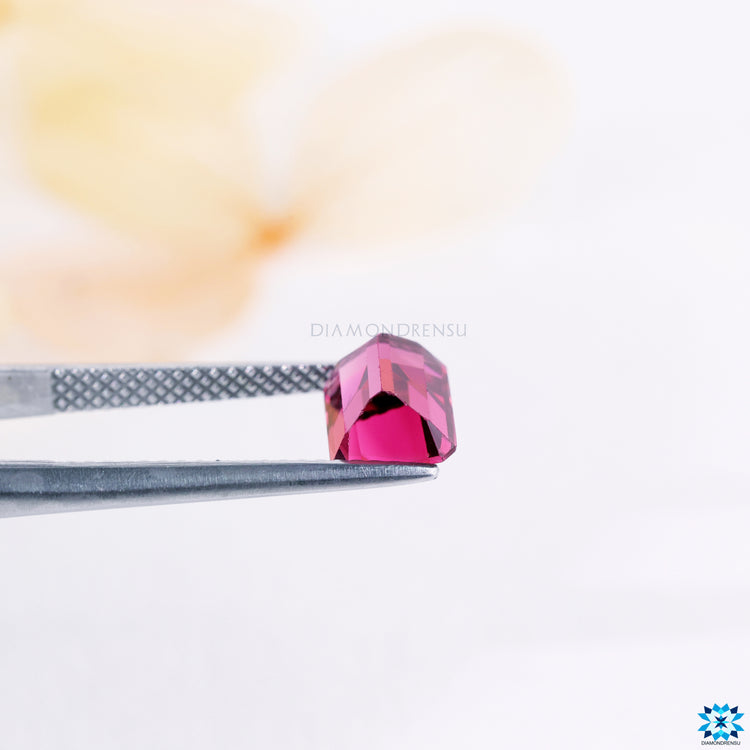 Step cut emerald gemstone october birthstone.