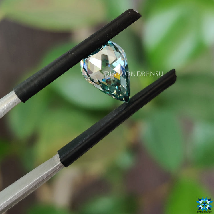 Cyan blue pineapple cut moissanite added to collection.