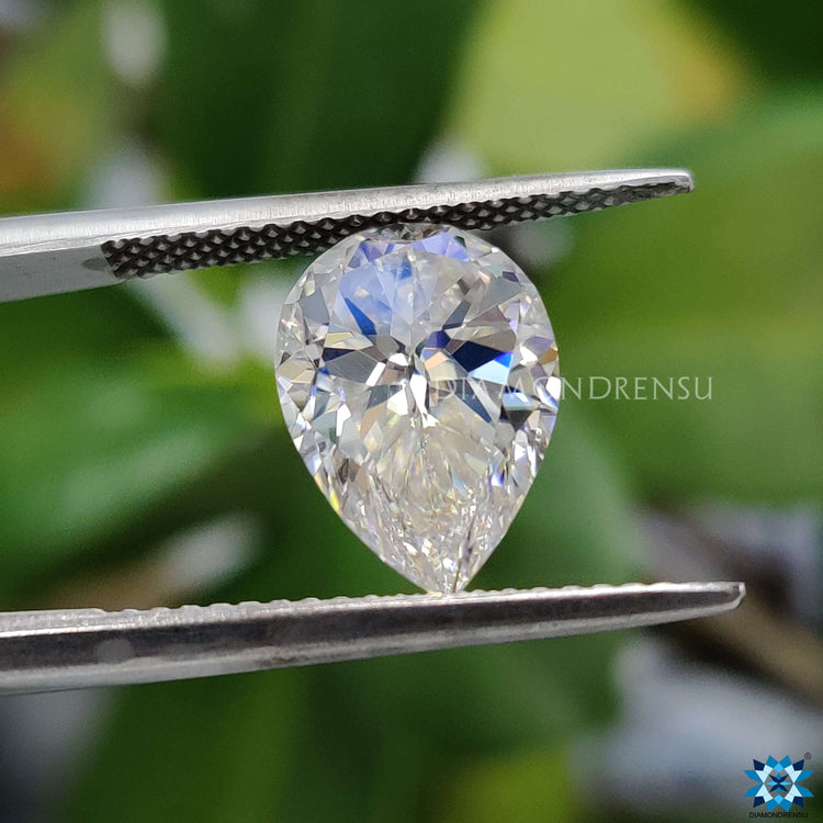 Pear cut moissanite reflecting moissanite stone brilliance.