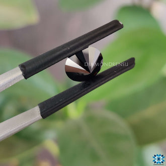 Moissanite loose stone next to round cut moissanite.