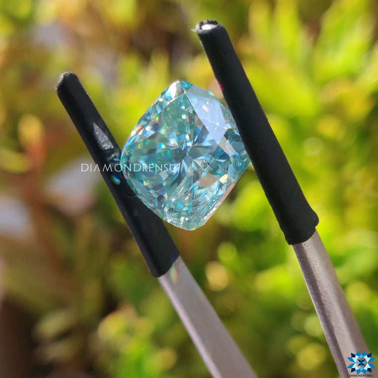Cyan blue moissanite shown as a loose stone for jewelry.