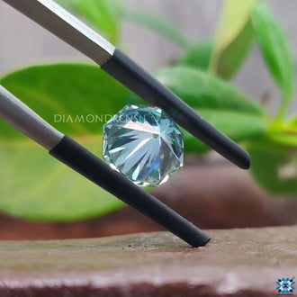 2.81 carat moissanite paired with cyan blue loose moissanite.