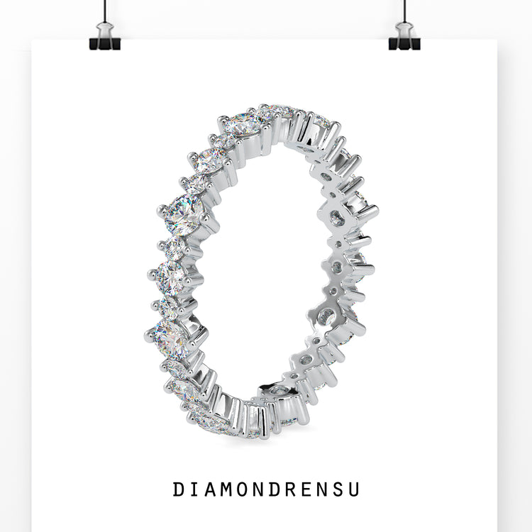 White gold wedding band featuring a full eternity band with round diamonds.