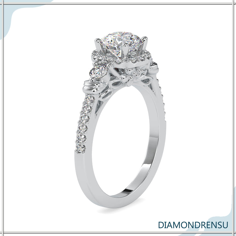 Three stone diamond ring with a floral engagement ring design.