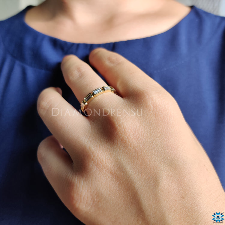 Handmade jewelry featuring a bezel set eternity band design.