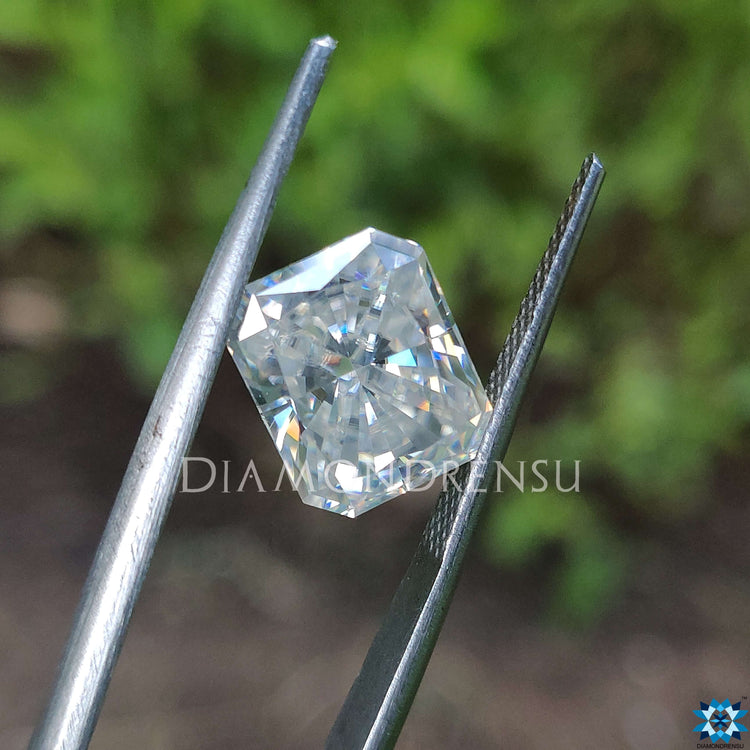 Radiant cut loose stone shining beside moissanite radiant cut.