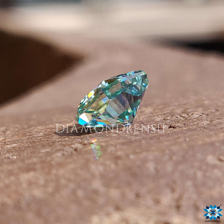 Loose moissanite stone in 1.85 carat radiant cut and vivid blue color.