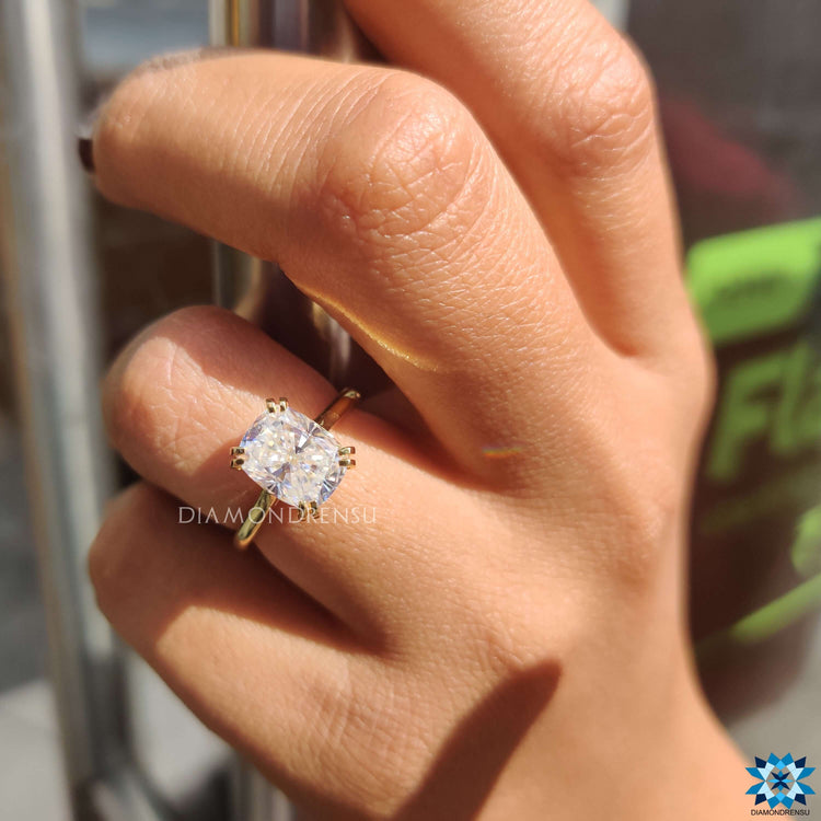 Sparkling elongated cushion cut moissanite centrepiece.