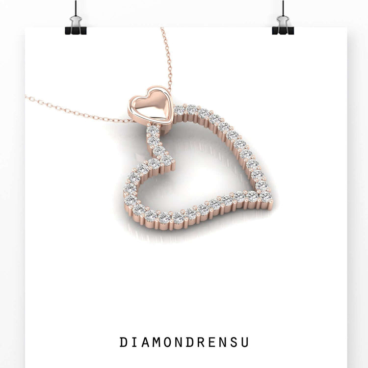 Round diamond necklace pendant set in a shared prong setting, featuring a delicate design.