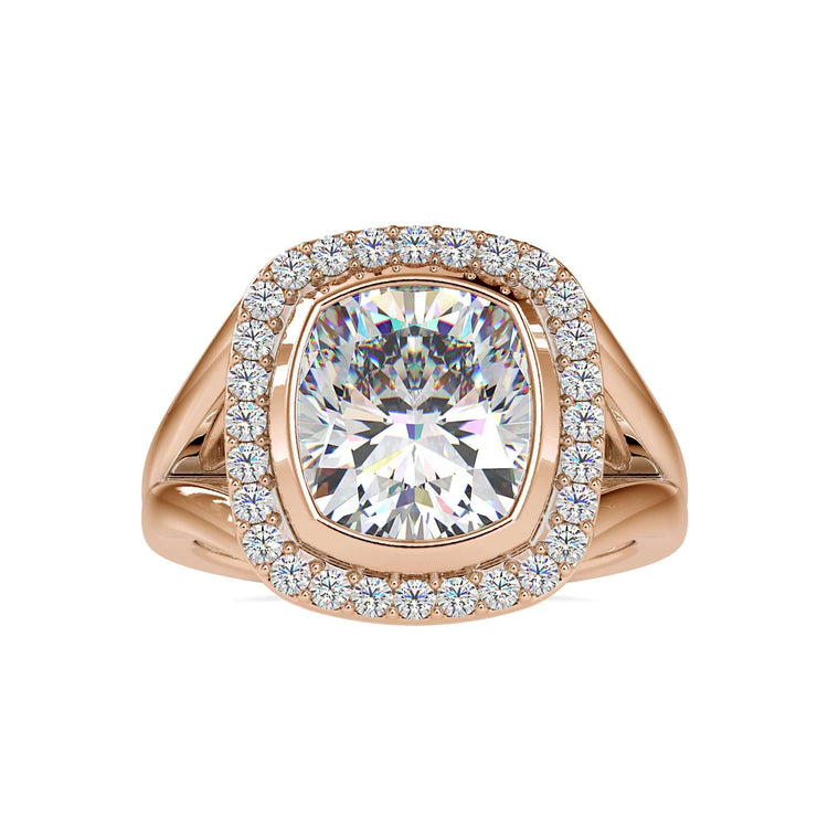 Split shank engagement ring with a cushion cut halo and handmade ring details.