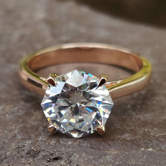 Octagon engagement ring in a stunning rose gold setting for a modern look.