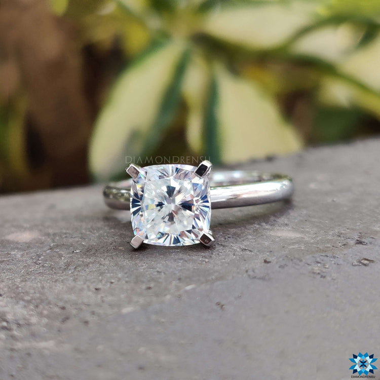Radiant cushion cut moissanite engagement ring with prong setting.