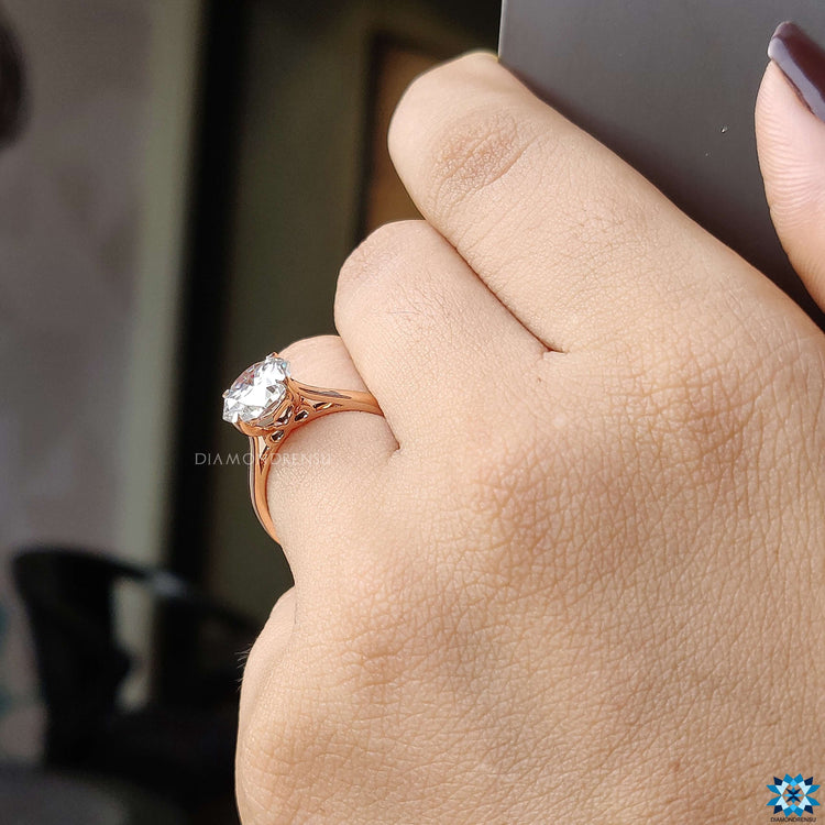 Classic four prong solitaire engagement ring in rose gold for a chic look.