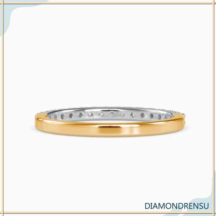 Diamond band for women with round diamonds in a 4-prong
engagement style.